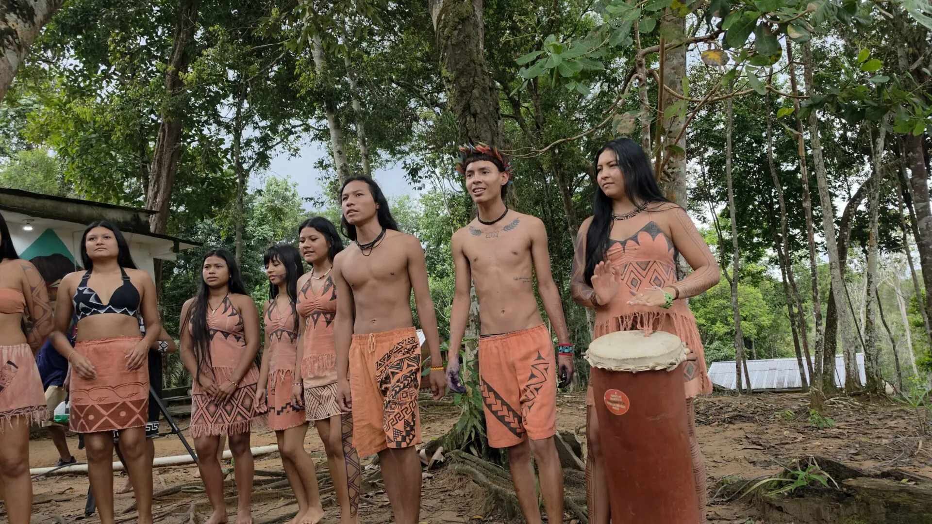 Group in traditional dress performing outdoors